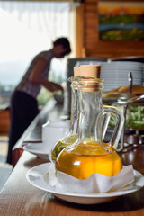 olive oil in a decanter with spout