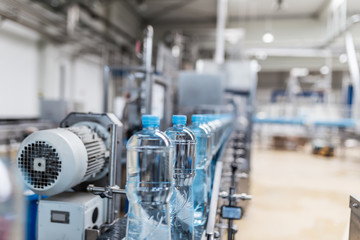Water factory - Water bottling line for processing and bottling pure spring water into small blue...