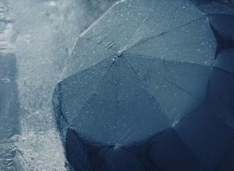 Rain, autumn, weather concept - rainy day, wet umbrella