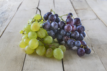 Grapes on wooden table.