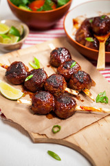 Sweet BBQ Meatballs in Barbecue Sauce. Selective focus.