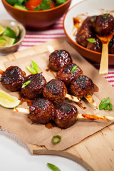 Sweet BBQ Meatballs in Barbecue Sauce. Selective focus.
