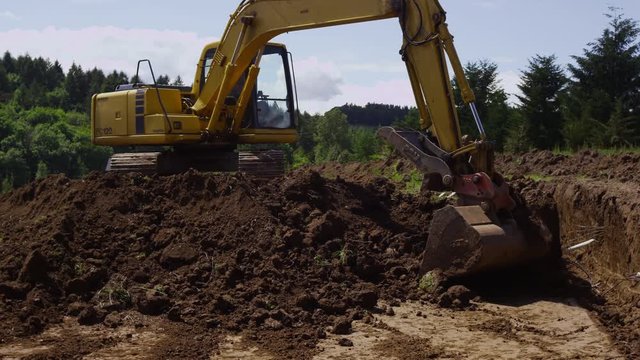 Excavator digging on job site