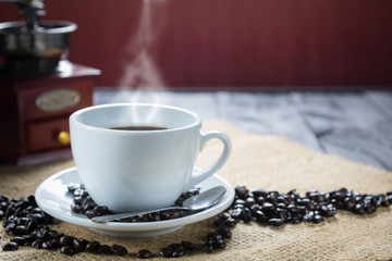 Coffee cup and beans on a rustic background. Coffee Espresso and