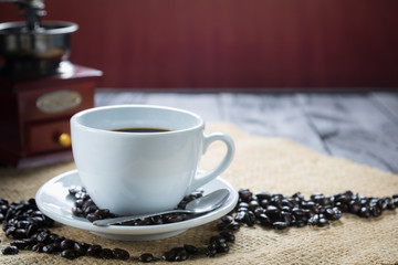Coffee cup and beans on a rustic background. Coffee Espresso and