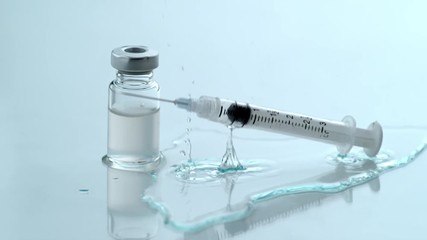 Syringe falling in slow motion - Powered by Adobe