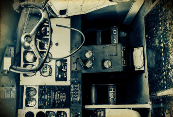 'Vintage Style' retro grunge image of vintage aircraft cockpit controls