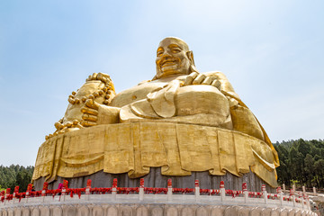 Big golden statue of Buddha in Qianfo Shan, also called mountain of the one thousand buddha, Jinan, Shandong Province, China
