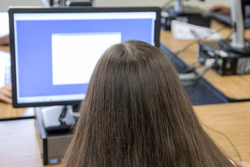 Young lady in computer class