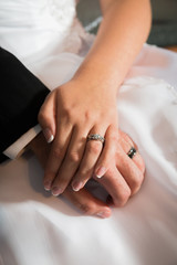 Husband and Wife wedding hands together with rings