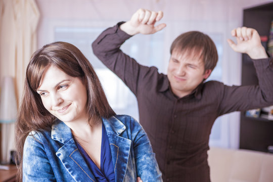 Family Violence Concepts. Young Caucasian Couple Quarrel Indoors