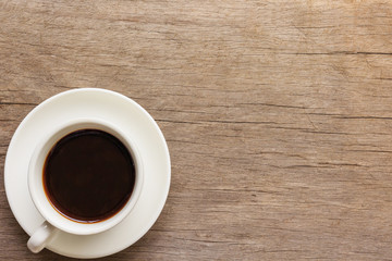 Coffee cup on wooden table.