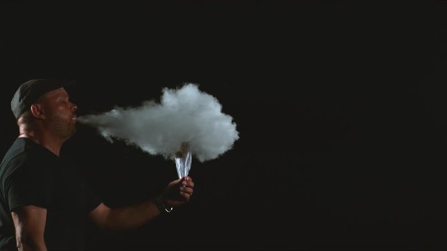 Man breathing fire in slow motion