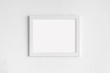 Blank Frame on White Wall Background