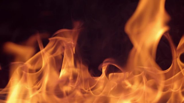 Closeup of fire burning on black background in slow motion; shot on Phantom Flex 4K at 1000 fps