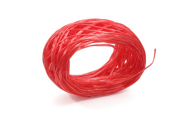 Red plastic rope isolated on white background