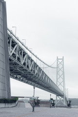The Akashi Kaikyo Bridge with sample of wire rope construction in Kobe, Japan.