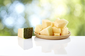 melon slice on wooden plate