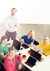 Fototapeta premium Students with teacher studying using modern technologies