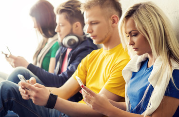 Fototapeta premium Happy students with smartphones