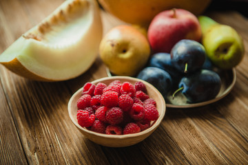 Assortment of fresh fruits and berries. Fruits plum, apple, pear.