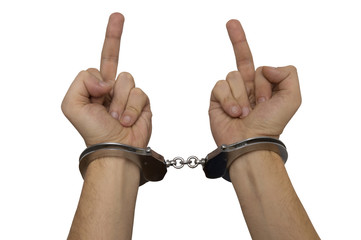 handcuffed man hands giving a finger isolated over white