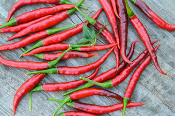 Red hot chili peppers on a old wooden table