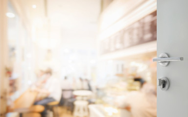 opened white door to coffee shop interior as background