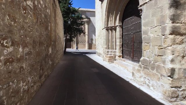Medieval neighborhood in Baeza, alleyway with stone arch, Jaen province, Andalusia, Spain