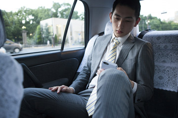 Businessman riding in the taxi
