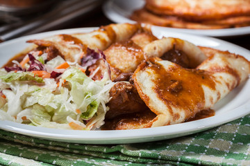 Potato pancakes with meat stew served