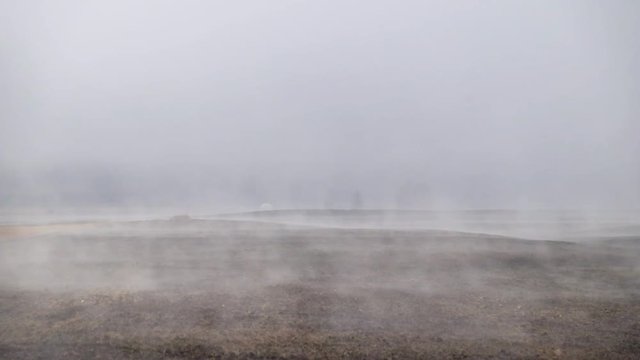 Arable land fallow in Altai near Multa village under morning mist wafts