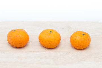 small orange or kumquat, mini size fruit.