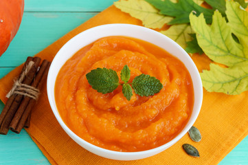 Organic pumpkin puree (soup) in a white bowl. Dietary dish. Baby food.