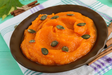 Organic pumpkin puree in a bowl. Dietary dish.