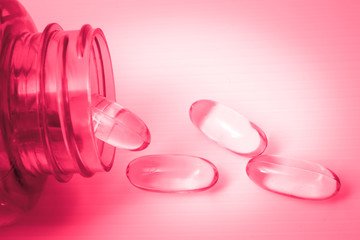 vitamins or supplements with red color tone, danger or side effect concept.