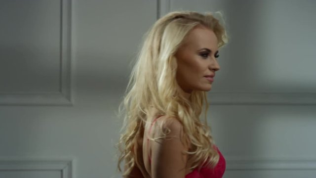 Pretty blond lady in cosy interior