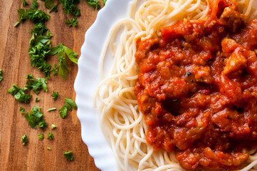 Italian spaghetti on a wooden table with text space