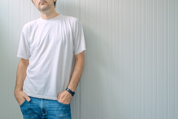 Casual man in jeans trousers and white t-shirt