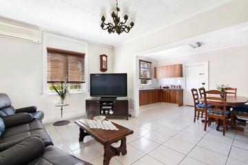 a large bright spacious living room with sofas
