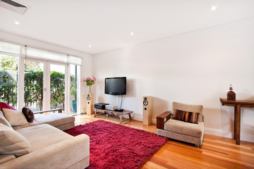 a large bright spacious living room with sofas
