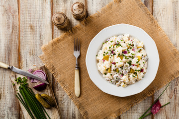 Traditional German potato salad with cucumber, onion and mayonna