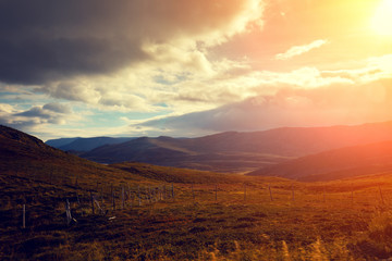 fjord at sunset with dramatic sky