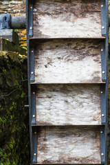 Side view of old water wheel