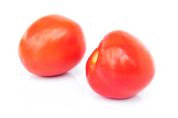 Closeup fresh red tomatoes on white background, food and vegetab