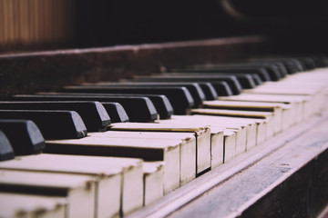 Old broken disused piano with damaged keys Vintage Retro Filter.