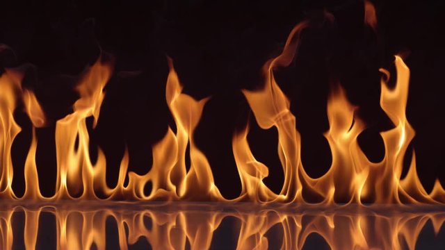 Flames burning on black background in slow motion