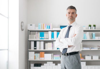 Confident businessman in his office