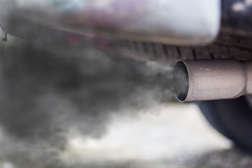 combustion fumes coming out of car exhaust pipe - obrazy, fototapety, plakaty