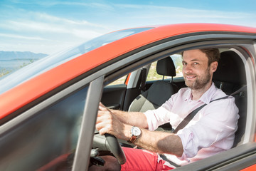 Forty years old caucasian man driving a car